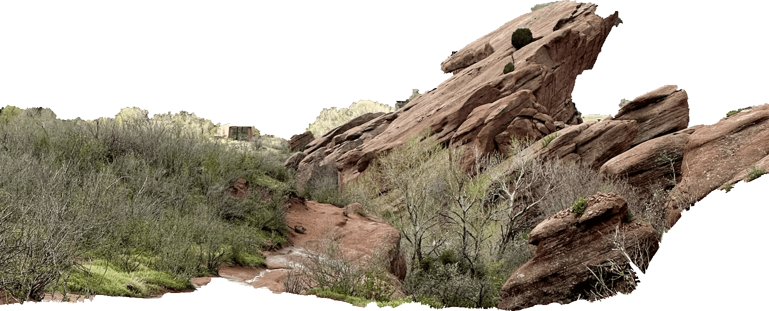Red rock formations and trees